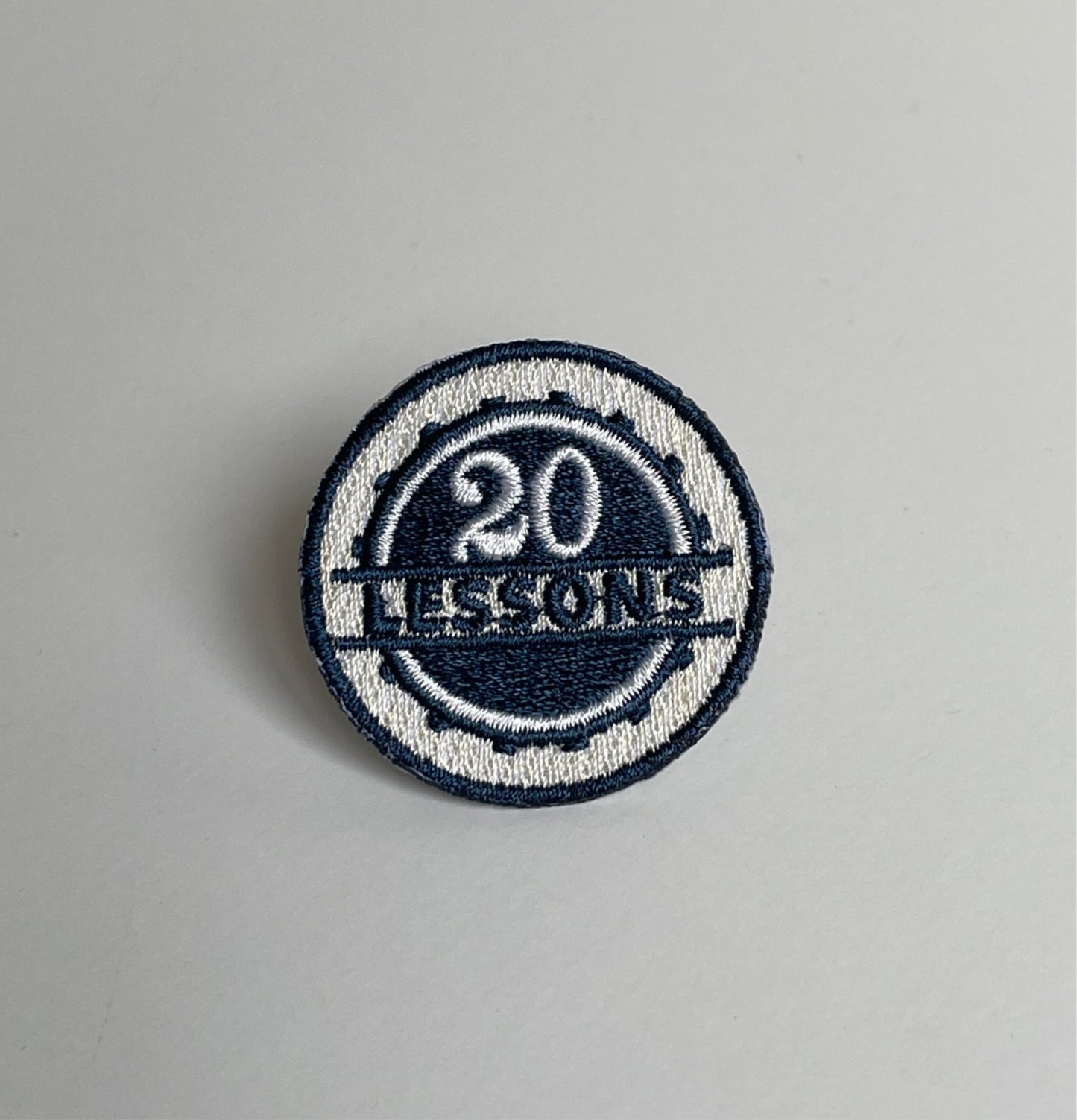 20 Lessons - Badge